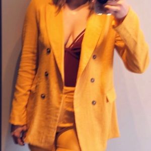 Yellow suit with burgundy body suite